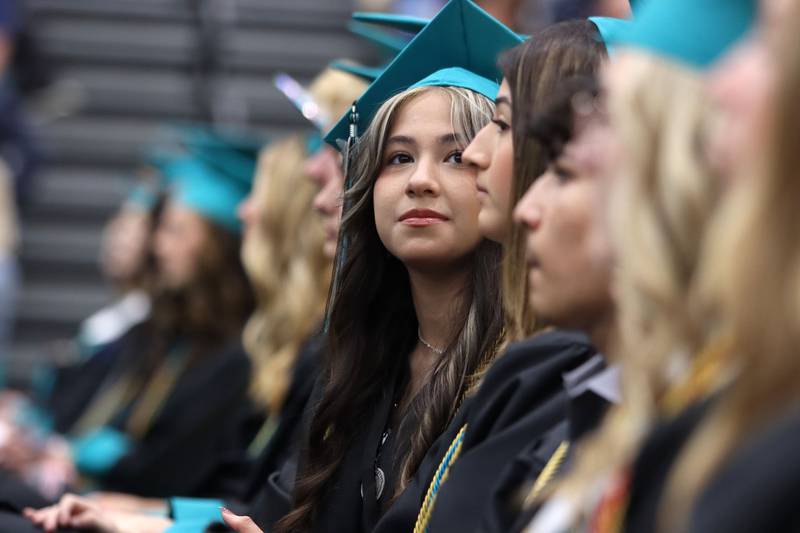 Members of the Class of 2025 listen during graduation at Woodstock North High School in Woodstock on Saturday, May 17, 2025.