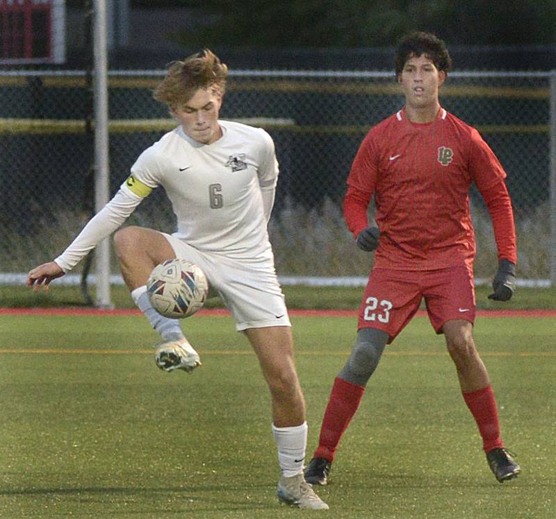 Kaneland’s Noah McKittrick stops a pass headed for La Salle-Peru’s Juan Gonzalez ball during the first half Monday in LaSalle.