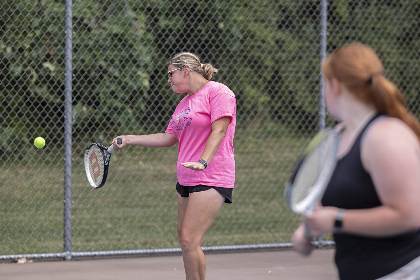 Emily Beattie returns a shot during a doubles match Thursday, July 27, 2023 at the Emma Hubbs Tennis Classic in Dixon.