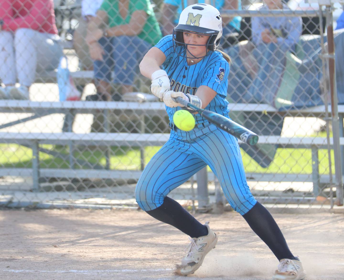 Marquette's Hunter Hopkins gets a hit against Seneca on Monday, May 11, 2026 at June Gross Field in Ottawa.