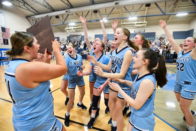 Cissna Park players rejoice as they received the IHSA Class 1A Blue Ridge Super-Sectional plaque following the Timberwolves' 47-35 victory over St. Teresa on Monday, March 3.