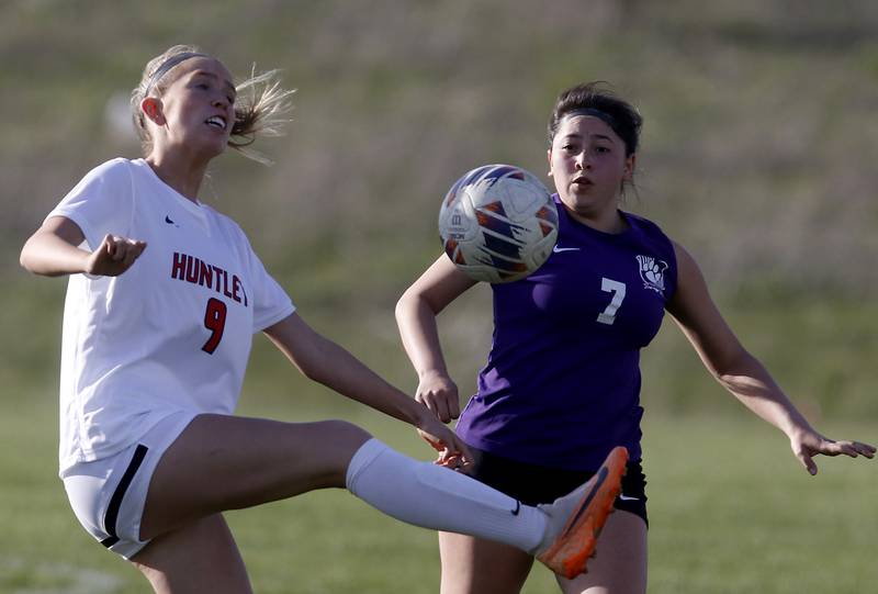 Huntley's Ava Trudeau kicks the ball in from tof Hampshire's Ilse Marquez during a Fox Valley Conference soccer game on Tuesday, April 23, 2024, at Hampshire High School.