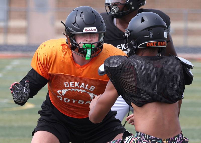 DeKalb’s Owen Sisson sets up to block Wednesday, July 15, 2025, during a summer practice session at the school.