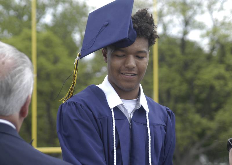 As his cap blows off, Kobe Bell accepts his diploma. The Sterling Class of 2026 Commencement Ceremony was held on Sunday, May 17, 2026 at Roscoe Eades Field in Sterling.