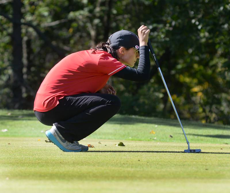 Oregon's Sarah Eckardt lines up for a putt  at the 1A regional at Wolf Hollow Golf Course in Lena on Tuesday, Oct. 1, 2024.