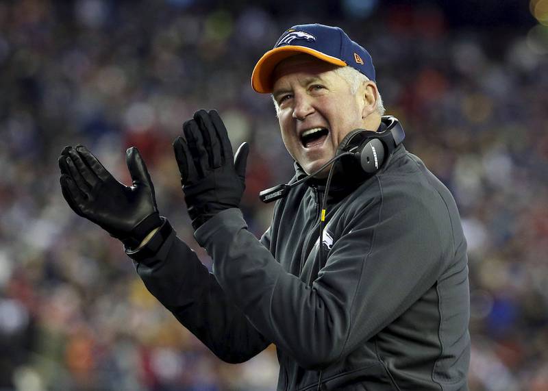 Then-Denver Broncos head coach John Fox cheers for his team Nov. 2, 2014, against the New England Patriots. The Bears reached an agreement Friday, Jan. 16, 2015, with Fox to become their head coach.