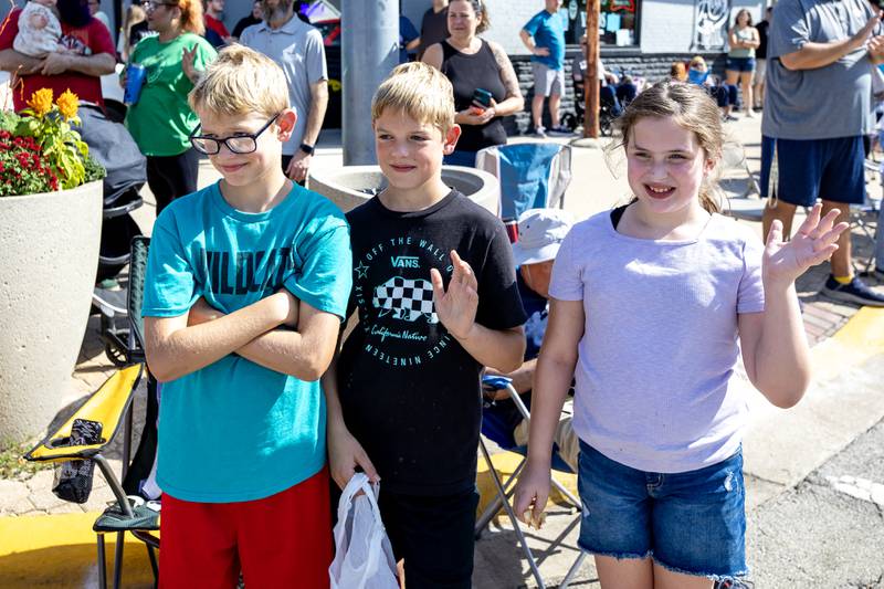 Caden, Connor, and Ana Colabaono enjoy the Grundy County Corn Festival Parade in Downtown Morris on Sept. 28, 2025.
