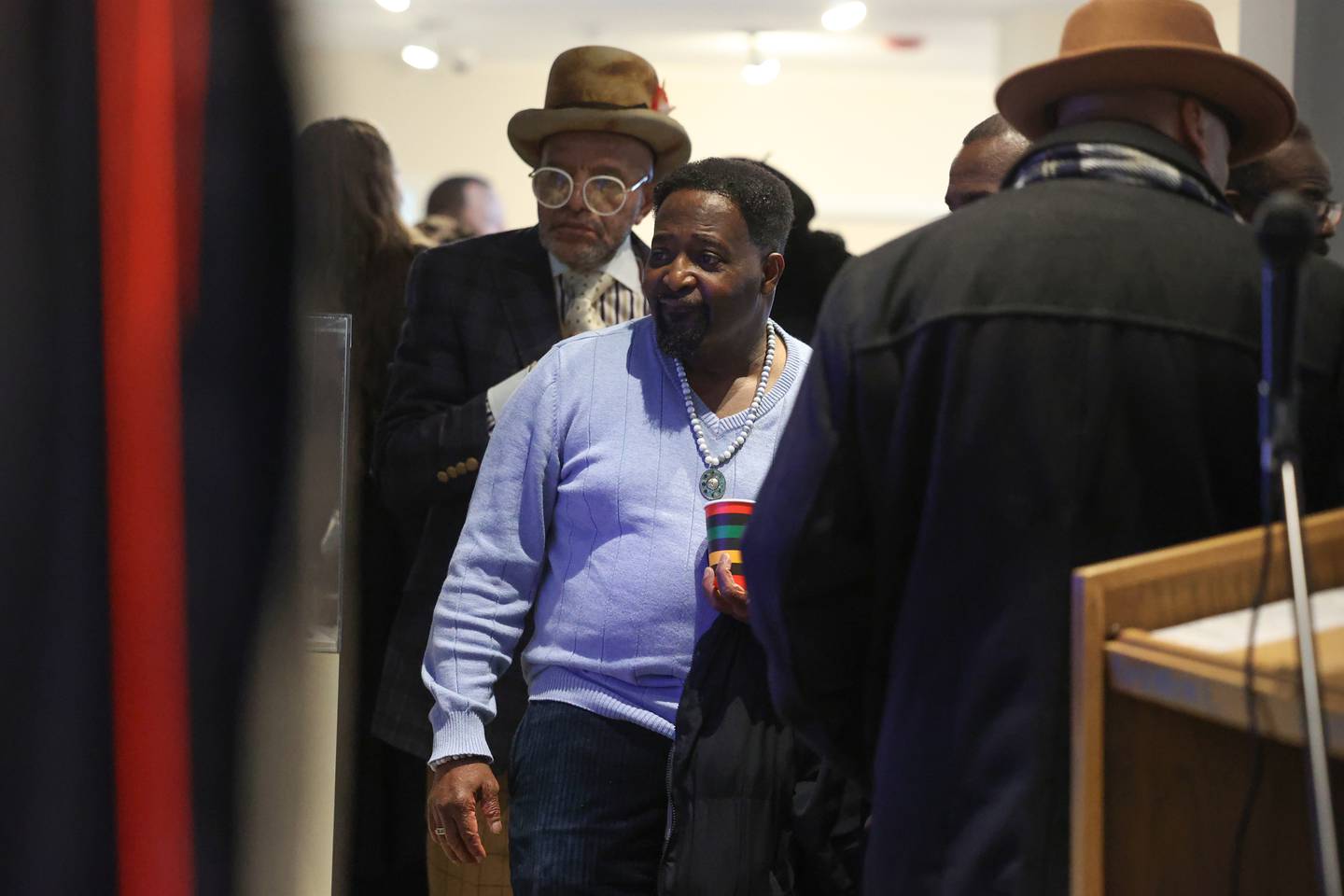Rickey Tucker, a 39-year parishioner of the late Kankakee civil rights leader Rev. William Copeland, watches a video tribute during the opening of the exhibit 'Called to Kankakee: The Life and Legacy of the Rev. William H. Copeland Jr.' at the Kankakee County Museum on Saturday, Feb. 7, 2026.