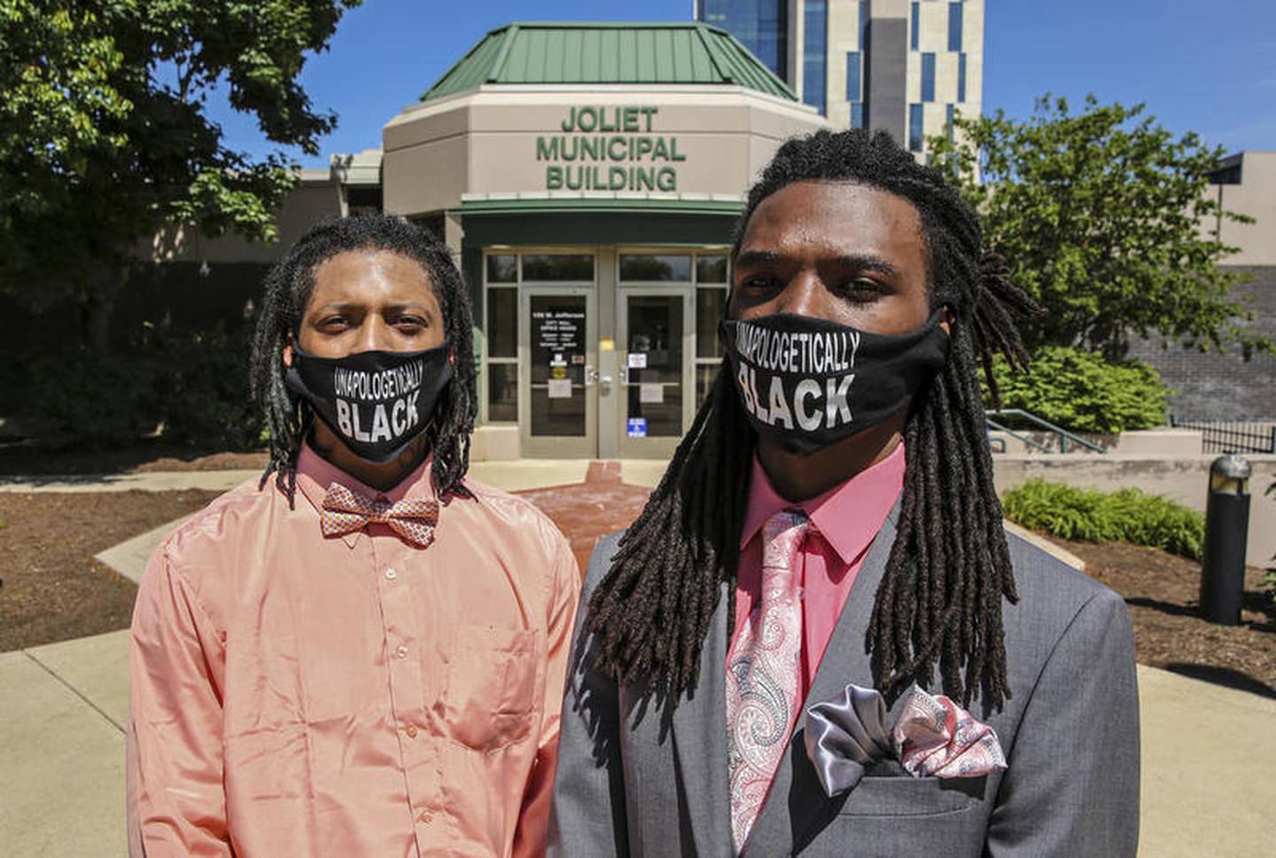 Jamal Smith and Victor Williams pose for a portrait Monday, Jun. 8, 2020, in front of city hall in Joliet, Ill.