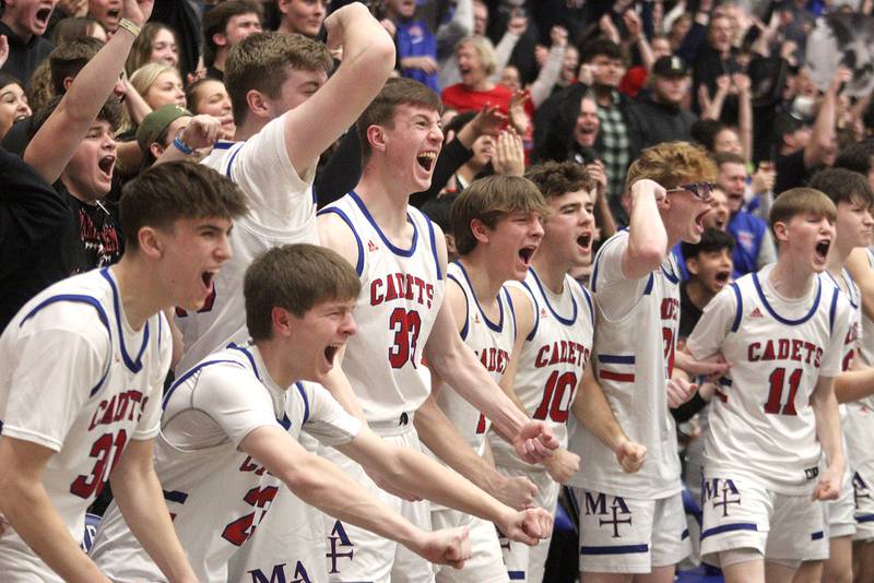 Marmion Academy players get revved up as the Cadets build a second-half lead in IHSA Class 3A Sectional title game action at Burlington Central High School Friday night.