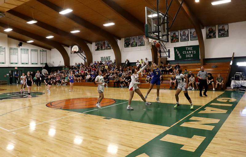 Johnsburg’s Sophie Person shoots the ball between Huntley's Yasmine Morsy and Woodstock North's Adelynn Saunders during the girl’s game of McHenry County Area All-Star Basketball Extravaganza on Sunday, April 14, 2024, at Alden-Hebron’s Tigard Gymnasium in Hebron.