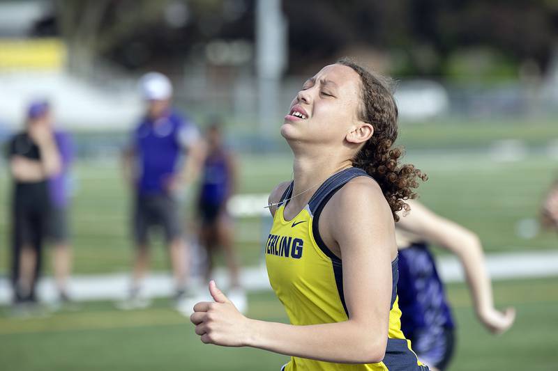 Sterling’s Anessa Johnson reacts after hitting a hurdle to slow her down in the 100 hurdles Thursday, May 11, 2023 at the class 2A Sterling girls track sectionals.