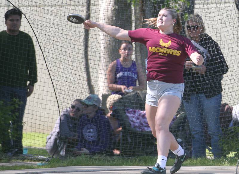 Morris's Lilah Montgomery throws discus during the Interstate 8 Conference girls track championship on Friday, May 9, 2025 at Morris High School.