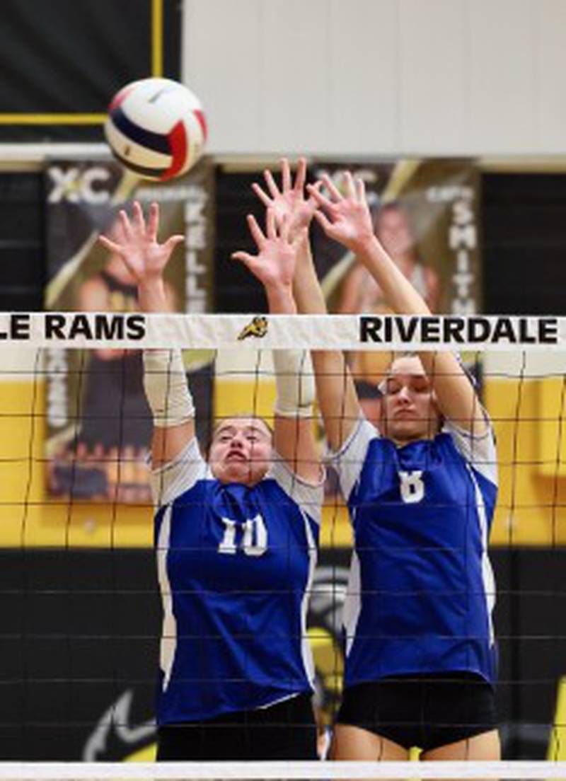 Princeton's Makayla Hecht and Keighley Davis put up for a block against Peoria Notre Dame in Tuesday's sectional semifinals at Riverdale.