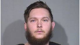 Marengo man accused of restraining woman by screwing apartment door shut