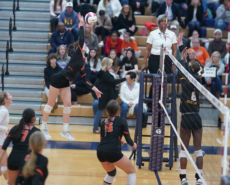 Lincoln-Way West's Caroline Smith (5) goes up for a kill against Joliet West during a class 4A Oswego Sectional semifinal match at Oswego High School on Monday, Oct. 30, 2023.