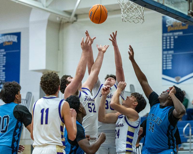 Cash Raikes (30) of Serena and teammate Hendrix Johnson (52) reach for rebound during game against IMSA in the quarterfinals of the Little Ten Conference Tournament on Monday, Feb. 2, 2026 at Somonauk High School in Somonauk.