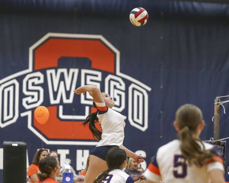 Romeoville's Aubree Westerfield (1) leaps high for a kill during volleyball match between Romeoville at Oswego. Oct 16, 2025.