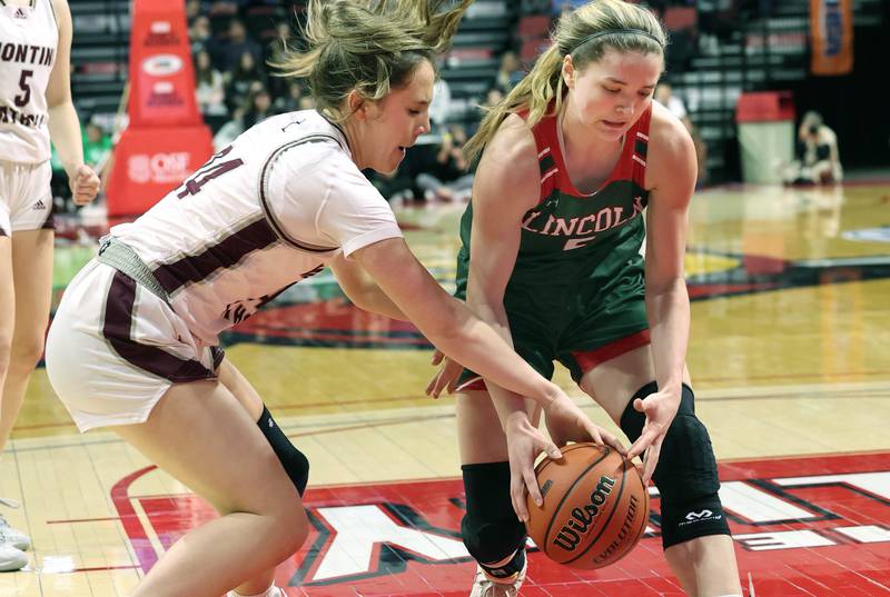 Montini's Peyton Farrell (left) and Lincoln's Kloe Froebe go after a loose ball during their game Friday, March 1, 2024, in the IHSA Class 3A state semifinal at the CEFCU Arena at Illinois State University in Normal.