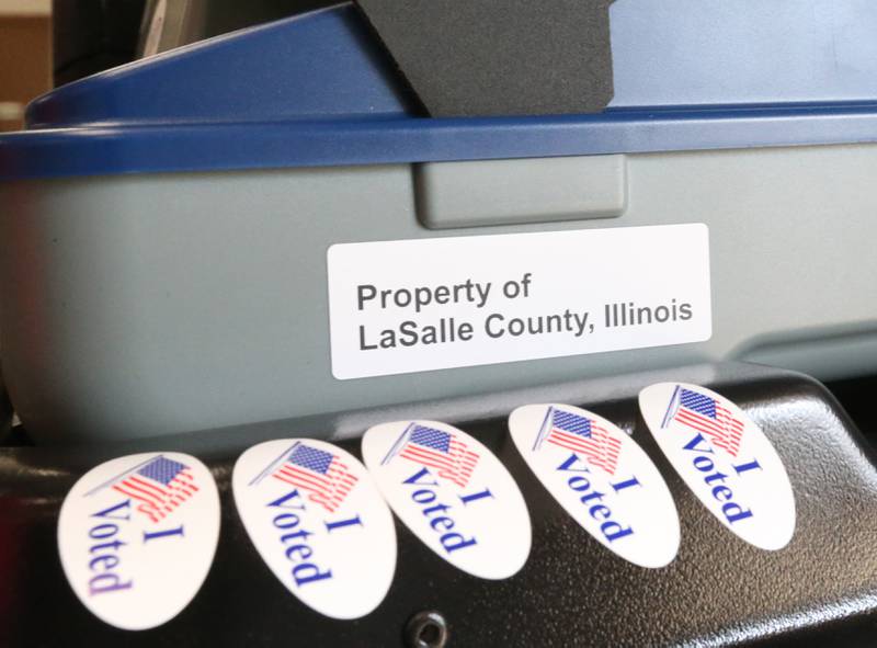 "I Voted" stickers rest on a ballot machine on Tuesday, March 19, 2024 at the VFW in La Salle.