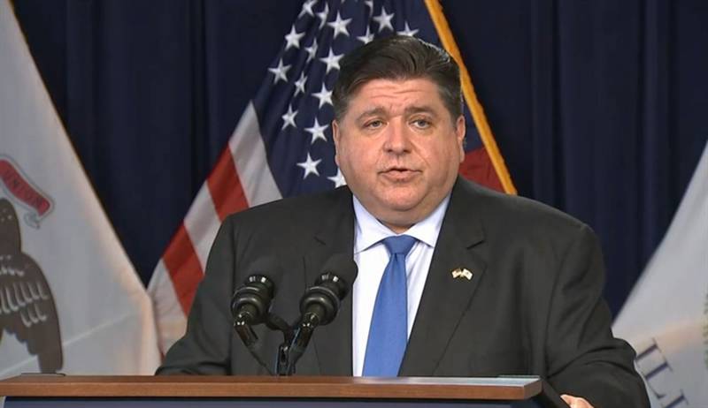 Gov. JB Pritzker gives a COVID-19 update at the James R. Thompson Center in Chicago Wednesday, mandating masks at schools, day cares and long-term care facilities.