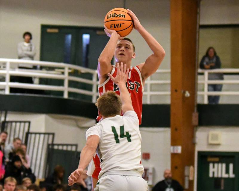 Glenbard East's Michael Nee (4) makes a shot while being defended by Glenbard West's Finn Sheeley (14) on Wednesday Nov. 26, 2025, during the District 87 Thanksgiving Invitational held at Glenbard West High School.