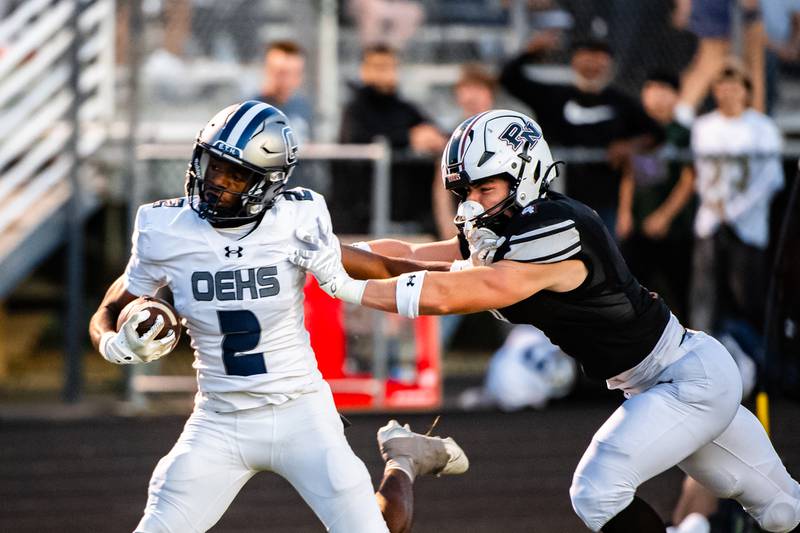 Oswego East's Brandon Solis runs in a touchdown during a game against Plainfield North on Friday Sept. 12, 2025 at Plainfield North High School in Plainfield