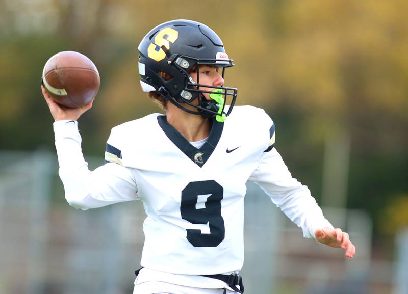 Sycamore’s Griffin Larsen passes in IHSA football Class 5A first-round playoff action at Al Bohrer Field on the campus of Cary-Grove High School in Cary on Saturday, November 1, 2025.