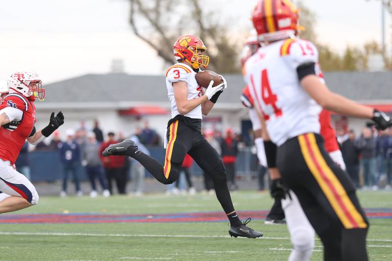 Batavia's Thomas Prescott pulls in a pass against St. Rita in the Class 7A state semifinal on Saturday, Nov. 22, 2025 in Chicago.