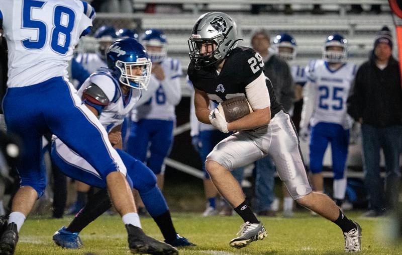 Kaneland’s Christopher Ruchaj (29) carries the Ball against Riverside Brookfield during a 6A playoff football game at Kaneland High School in Maple Park on Friday, Oct 28, 2022.
