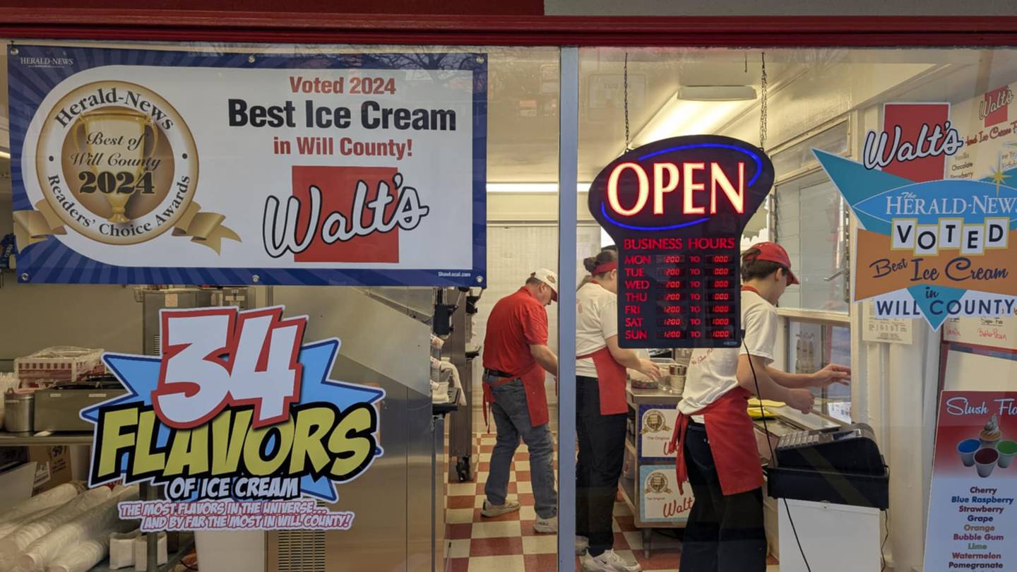 Bill Dillon, co-owner of Walt's Ice Cream in Joliet, works with his crew to serve a steady flow of customers during the ice cream shops opening day on Saturday, March 1, 2025.
