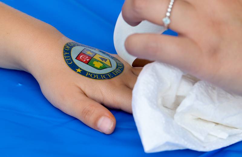 Kids were able to get Geneva Police temporary tattoos during Geneva's first National Night Out event on Tuesday, Aug 5, 2025 in Geneva.