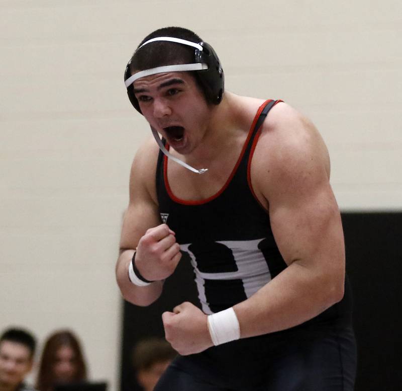 Huntley’s Markos Mihalopolus celebrates defeating Hampshire's Joseph Ochoa during the 285-pound match of a Fox Valley Conference wrestling match Wednesday, Jan. 24, 2024, at Huntley High School.
