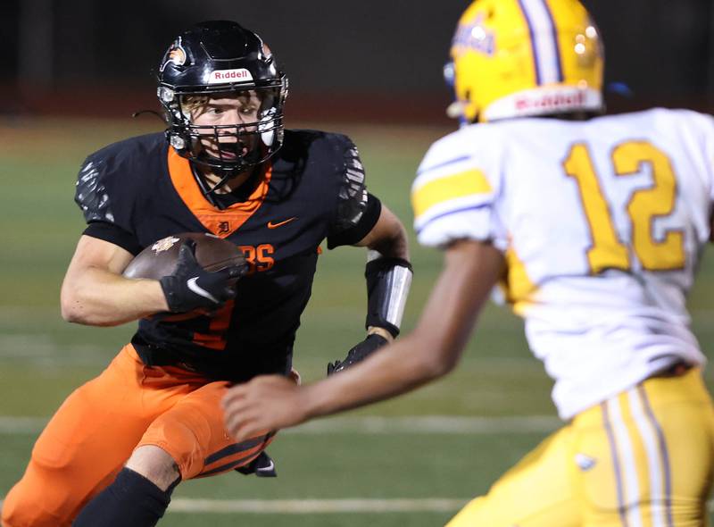 DeKalb's Talen Tate looks to get by a defender during their game against Sandburg Friday, Sept. 8, 2023, at DeKalb High School.