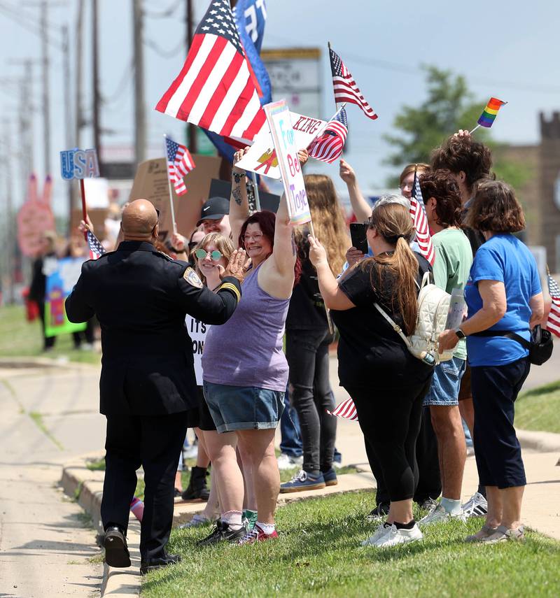 DeKalb Police Chief David Byrd talks to protesters Saturday, June 14, 2025, during a No Kings rally along Sycamore Road at Hopkins Park in DeKalb. The group was protesting the policies of President Donald Trump and his administration.