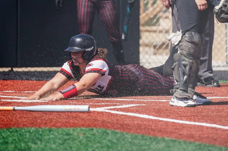 Yorkville's Kayla Kersting slides into home to score a run against Antioch during a nonconference softball game at Yorkville High School on Saturday, April 12, 2025.
