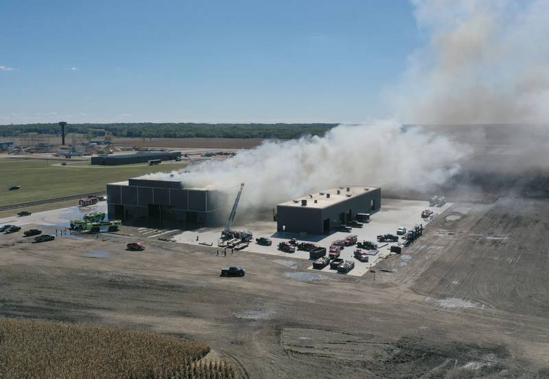 Smoke billows from Marquis Energy as firefighters work to control a structure fire on Wednesday, Oct. 8, 2025 in Hennepin. The fire was upgraded to a 5th alarm dispatching the (MABAS) Mutual Aid Box Alarm System. The fire broke out around 11a.m.