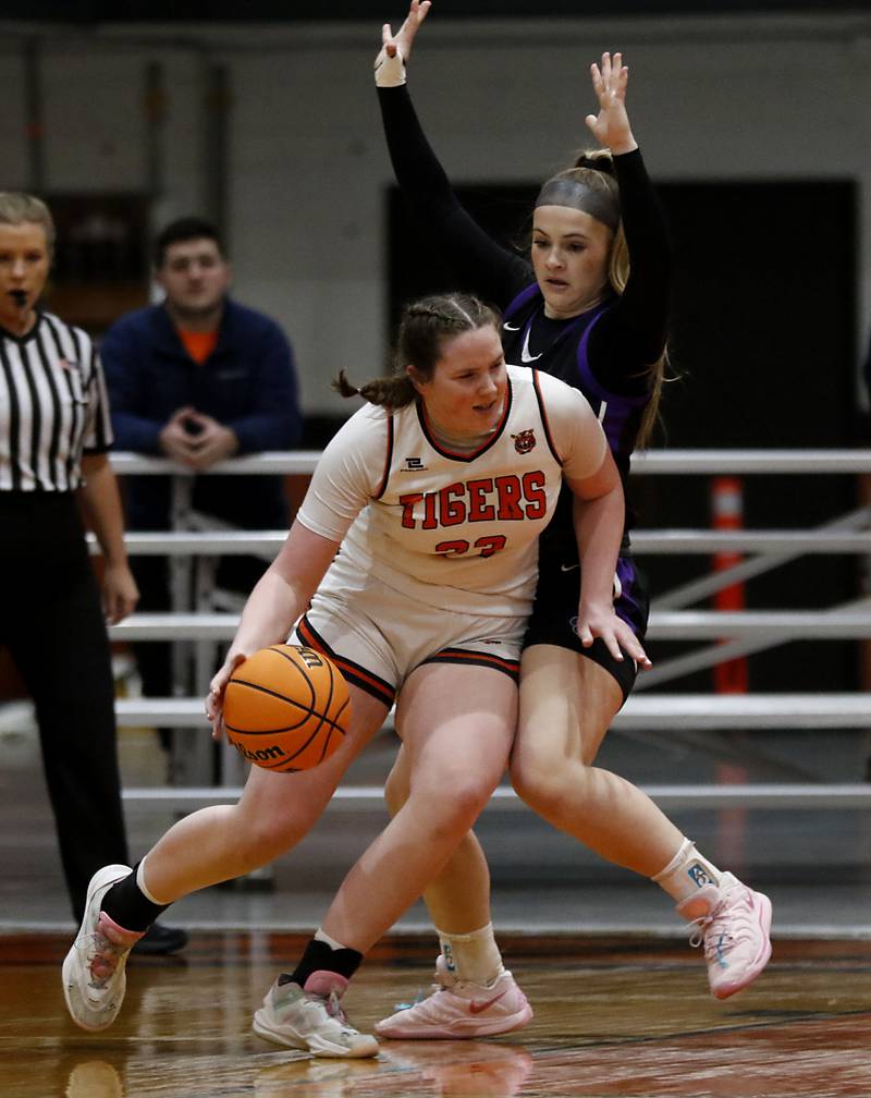 Crystal Lake Central's Leah Spychala drives to the basket against Hampshire's Chloe Van Horn during a a Fox Valley Conference basketball game on Friday, Feb. 7, 2025, at Crystal Lake Central High School.