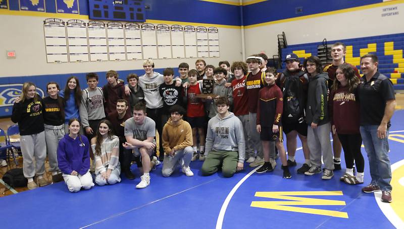 Richmond-Burton poses with the  Kishwaukee River Conference Wrestling Championship trophy after they defeated Johnsburg on Thursday, Jan. 30, 2025, at Johnsburg High School.