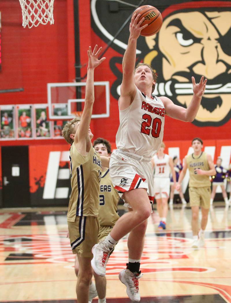 Earlville's Griffin Cook runs in the lane to score over Serena's Tanner Faivre on Friday, Feb. 9, 2024 at Earlville High School.