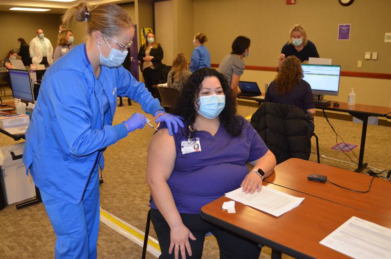 Shelby Johnson, RN administers the COVID vaccine to Maribel Montelongo on Tuesday morning, Dec. 29, at Northwestern Medicine Kishwaukee Hospital in DeKalb. (Provided)