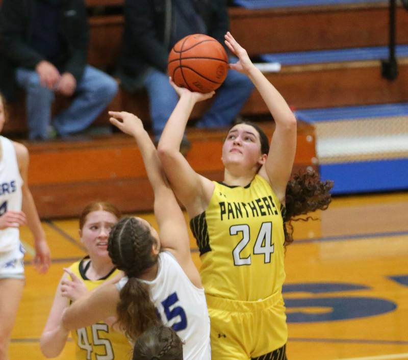 Putnam County's Maggie Richetta shoots a jump shot over Princeton's Olivia Mattingly during the Princeton High School Lady Tigers Holiday Tournament on Thursday, Nov. 16, 2023 at Prouty Gym.