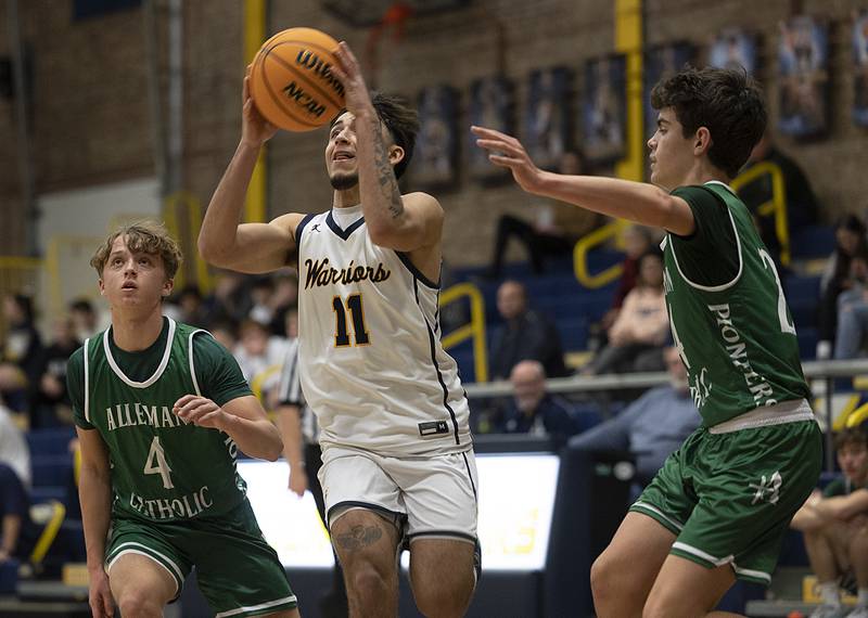 Sterling’s Nico Battaglia puts up a late first half shot against Alleman Friday, Dec. 20, 2024, at Sterling High School.