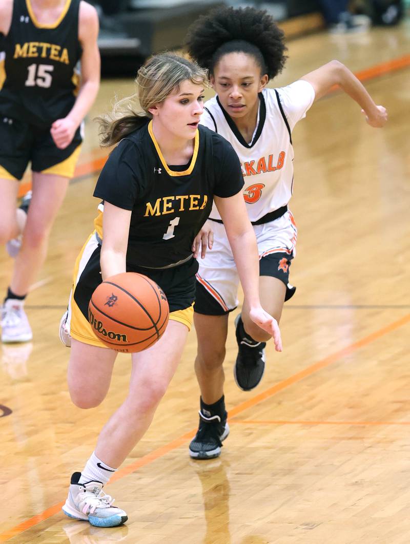 Metea Valley's Reese Valha pushes the ball up the court ahead of DeKalb's Madison McNeil during their game Thursday, Jan. 19, 2023, at DeKalb High School.