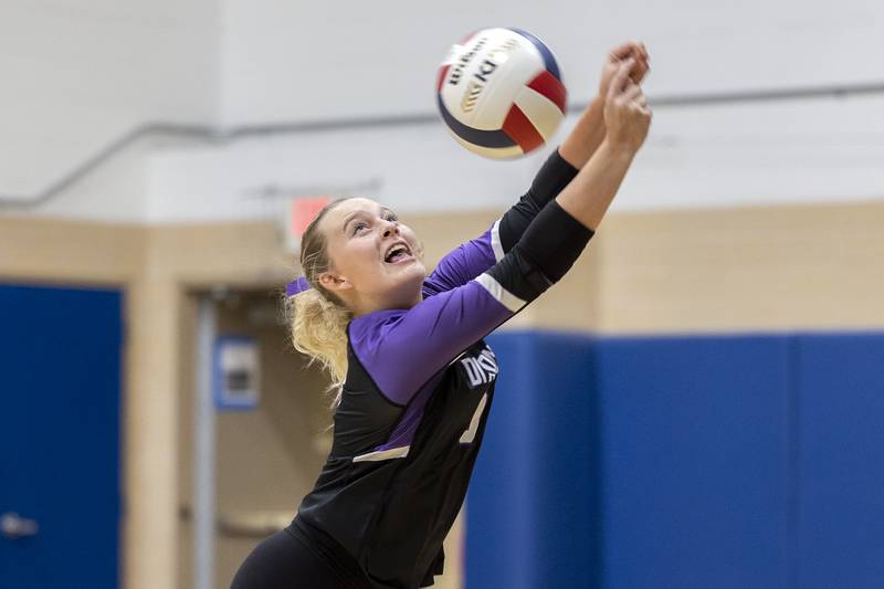 Dixon’s Emma Olson reaches for a shot against Newman Thursday, Oct. 3, 2024, at Newman High School.