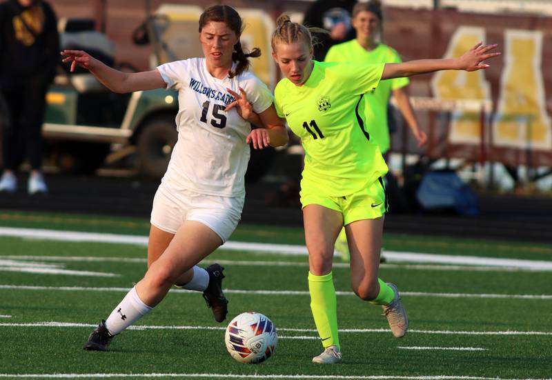 Richmond-Burton’s Margaret Slove, right, battles Willows’ Veronica Presberg in Class 1A Sectional title soccer action at Richmond Friday night.