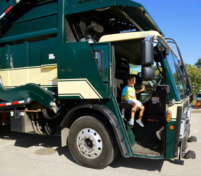 Waylon Ward sits in a garbage truck at the Touch a Truck event at Yorktoberfest in Yorkville on Saturday, Sep. 27, 2025.