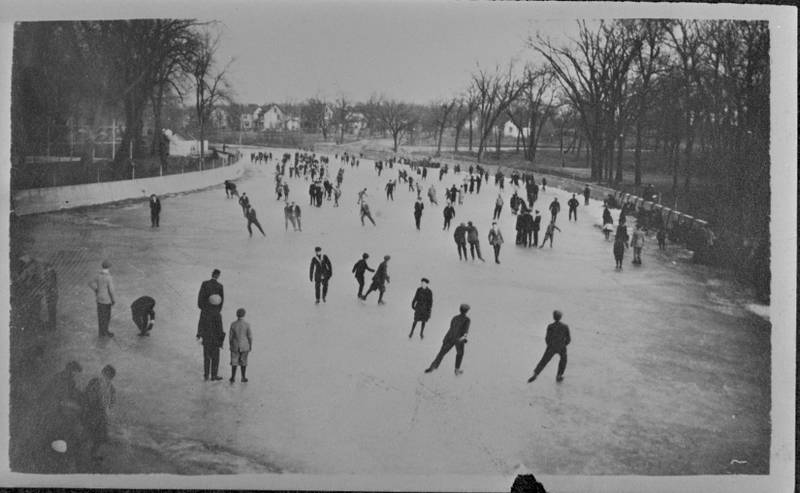 People ice skate around Hickory Creek in Joliet in 1914.
