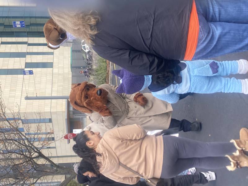 McGruff high-fives Bluey at the Joliet Police Department Trunk-or-Treat event. 
Saturday, Oct. 25, 2025.