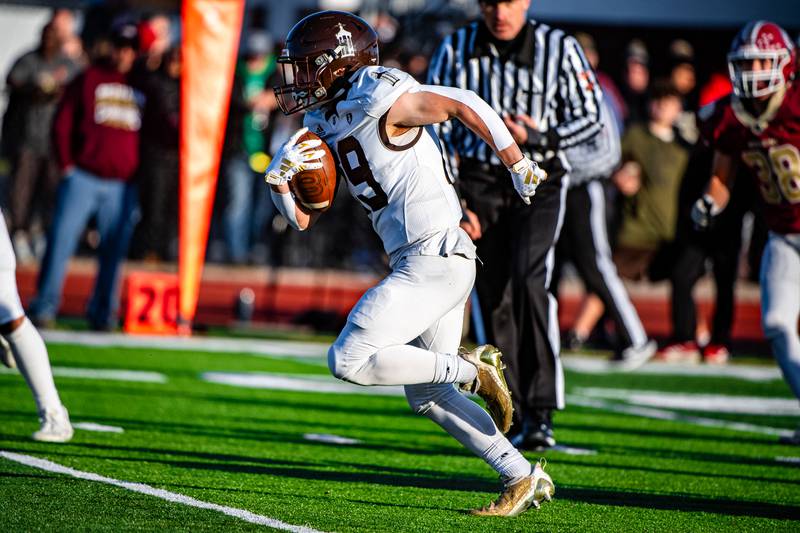 Joliet Catholic Accademy's Keegan Farnaus runs a play during the 5A Quarterfinals game on Saturday Nov. 11, 2023 at Morris High School